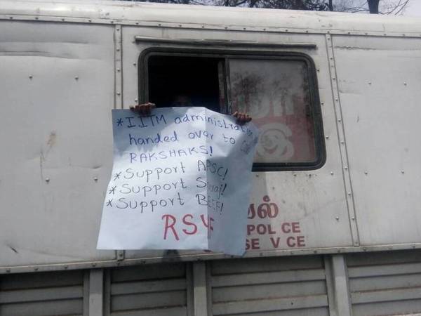 Revolutionary Students and Youth Front hold a placard