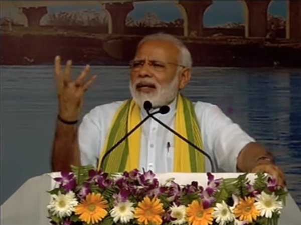 PM Narendra Modi addressing a rally at Dhola, Assam (Image courtesy - BJP/Twitter) PM Narendra Modi addressing a rally at Dhola, Assam (Image courtesy - BJP/Twitter)