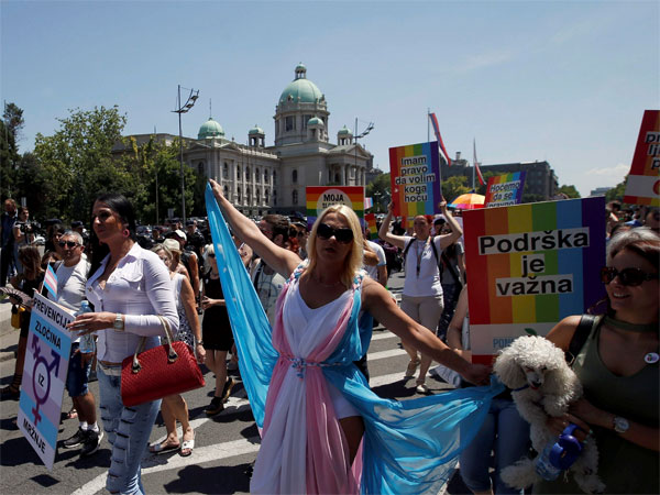 People dance during the gay pride parade in Belgrade, Serbia. 
