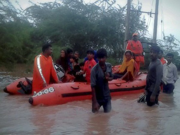 Villagers in rescue boat