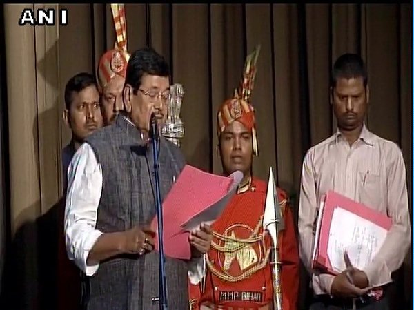 Ramesh Rishidev taking oath at Raj Bhawan