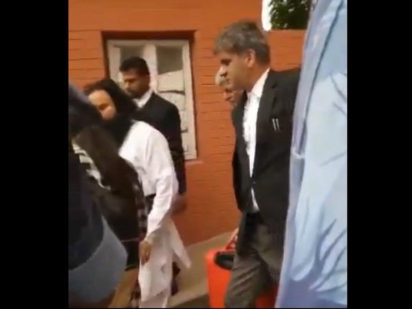 Haryana Deputy Advocate General seen carrying Dera chief's briefcase. Courtesy: rozanaspokesman Haryana Deputy Advocate General seen carrying Dera chief's briefcase. Courtesy: rozanaspokesman