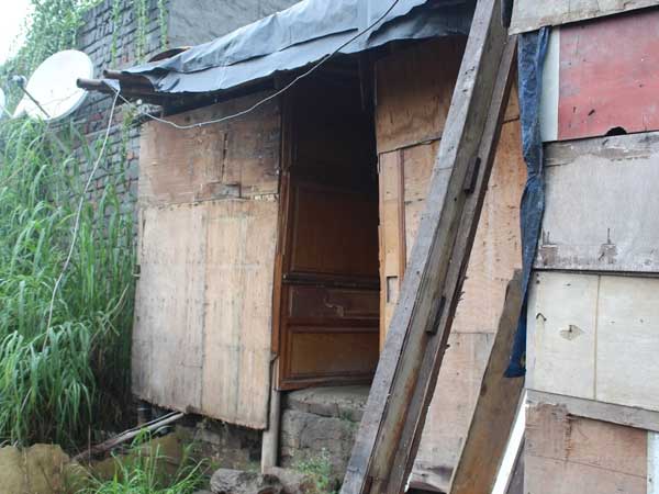 One of the two bathrooms shared by the 50 families at the camp.