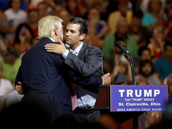 US President Donald Trump hugs his son Donald Trump Jr. PTI file photo US President Donald Trump hugs his son Donald Trump Jr. PTI file photo