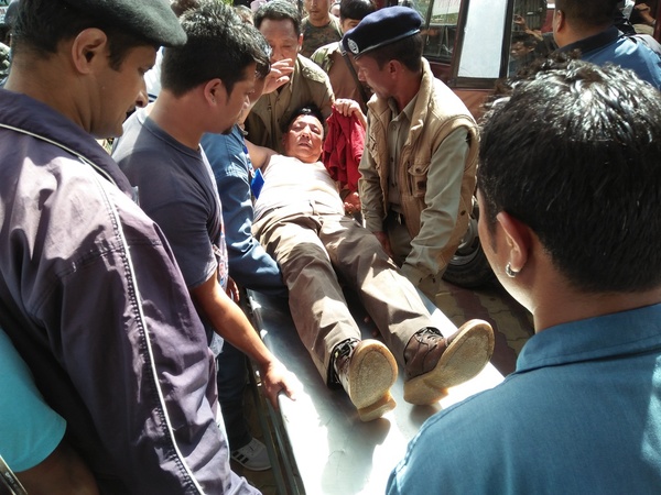 Injured policeman being brought to the Darjeeling hospital