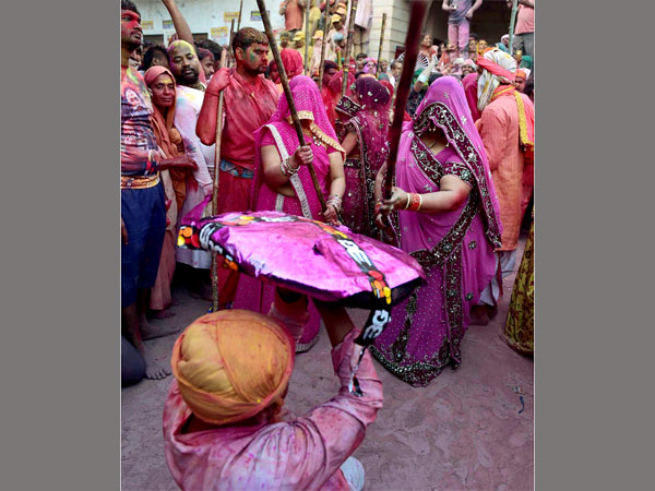 Women beat men with sticks as part of a tradition