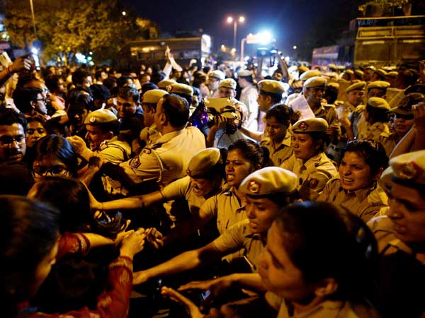 Security personnel stop JNU students during their protest against JNU professor Security personnel stop JNU students during their protest against JNU professor