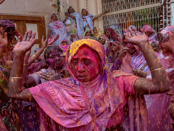 Widows in India get drenched in colours of Holi