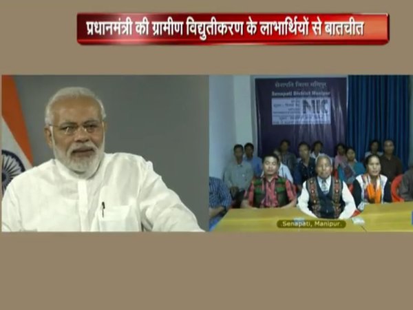 PM interacting with beneficiaries of electrification drive