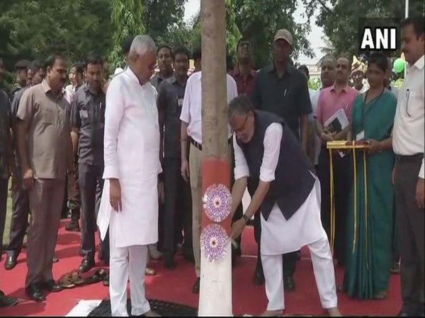 Tying Rakhi to trees