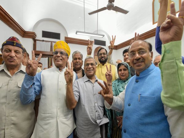 Harivansh Narayan Singh shows the victory sign after filing his nomination to RS. PTI file photo