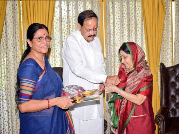 Sushma Swaraj ties Rakhi to Venkaiah Naidu