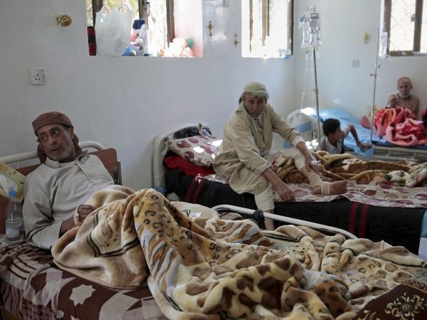 Men are treated for suspected cholera infection