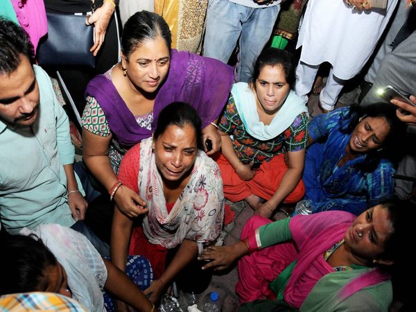 Relatives of victims of train accident mourn at civil Hospital at Joda Phatak in Amritsar