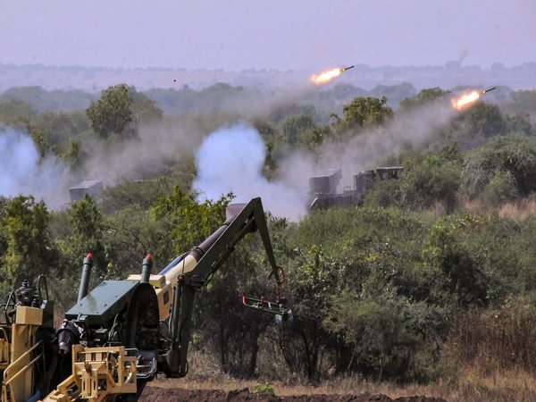 M777 Howitzer gun fires in the air 