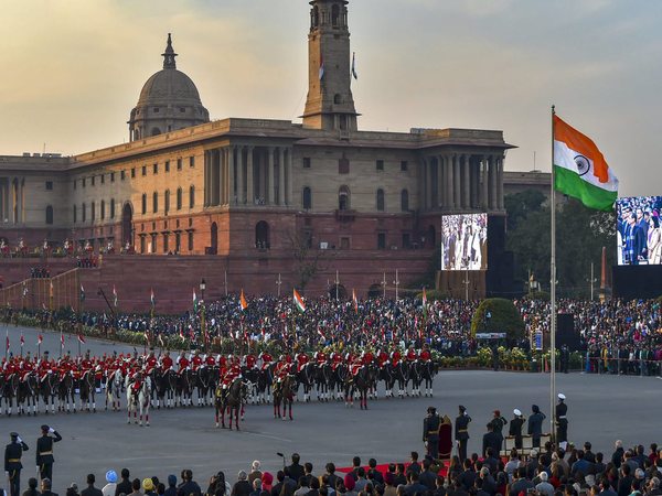 The national flag is unfurled as President Ram Nath Kovind and tri-services chiefs pay their salute during the Beating Retreat ceremony