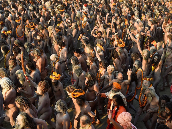 Juna Akhara Sadhus arrive to take a holy dip at Sangam on the auspicious Makar Sankranti day 