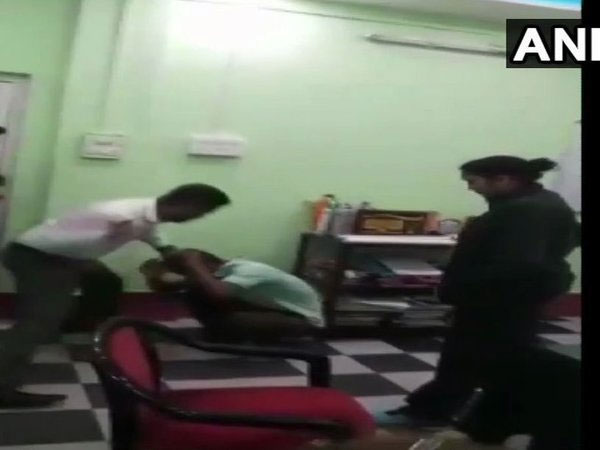 District Magistrate of Alipurdua caught on camera thrashing a youth. Courtesy: ANI news District Magistrate of Alipurdua caught on camera thrashing a youth. Courtesy: ANI news