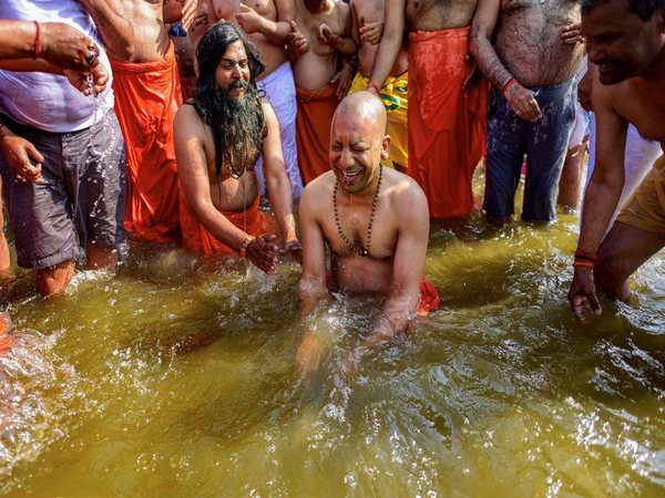 Yogi Adityanath taking the holy dip (Image - PTI) Yogi Adityanath taking the holy dip (Image - PTI)