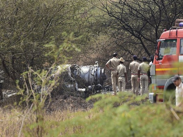 Police personnel stand near the wreckage of the Mirage-2000 fighter aircraft after it crash landed in Bengaluru on Friday (Feb 1) (Image courtesy - PTI) Police personnel stand near the wreckage of the Mirage-2000 fighter aircraft after it crash landed in Bengaluru on Friday (Feb 1) (Image courtesy - PTI)