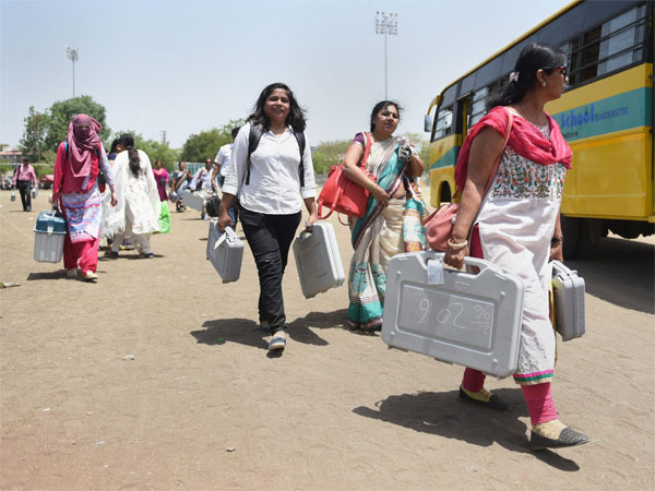 Election officials carry polling materials from a distribution station to polling booths, ahead of the seventh and last phase of Lok Sabha polls Election officials carry polling materials from a distribution station to polling booths, ahead of the seventh and last phase of Lok Sabha polls