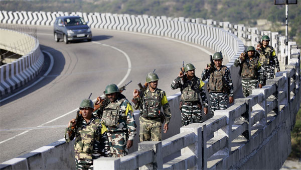 Central Reserve Police Force (CRPF) soldiers patrol the Jammu & Kashmir National Highway ahead of the upcoming Amarnath yatra, in Jammu district Central Reserve Police Force (CRPF) soldiers patrol the Jammu & Kashmir National Highway ahead of the upcoming Amarnath yatra, in Jammu district