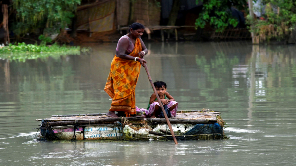 A Villager usees a raft in flood-affected area in Assam. PTI file photo A Villager usees a raft in flood-affected area in Assam. PTI file photo