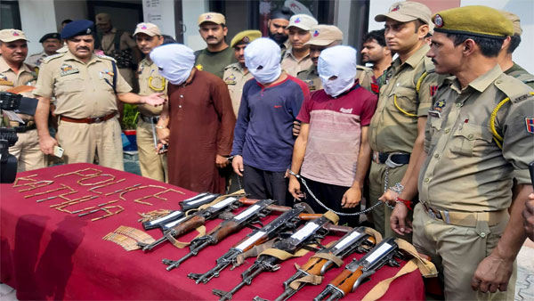 Police personnel show three suspected Jaish-e-Mohammad terrorists, who were arrested after recovery of a huge load of arms and ammunition from a Kashmir-bound truck, in Kathua, Jammu Police personnel show three suspected Jaish-e-Mohammad terrorists, who were arrested after recovery of a huge load of arms and ammunition from a Kashmir-bound truck, in Kathua, Jammu
