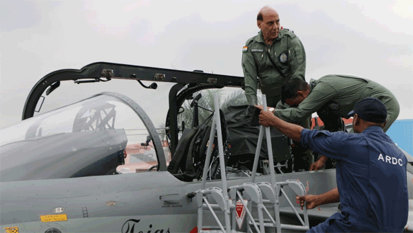 Dressed in G-suit, Rajnath Singh flies in home-grown fighter jet Tejas aircraft