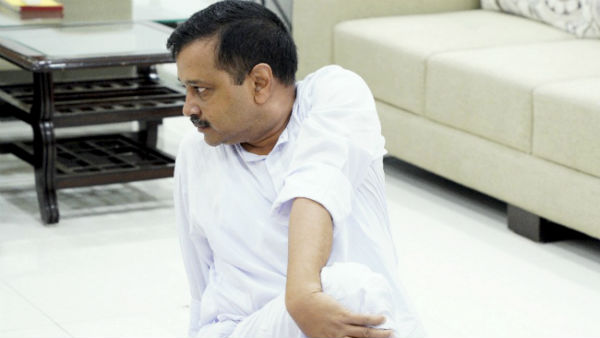 Arvind Kejriwal performs yoga at official residence, Delhi BJP leaders practice asanas in groups Arvind Kejriwal performs yoga at official residence, Delhi BJP leaders practice asanas in groups