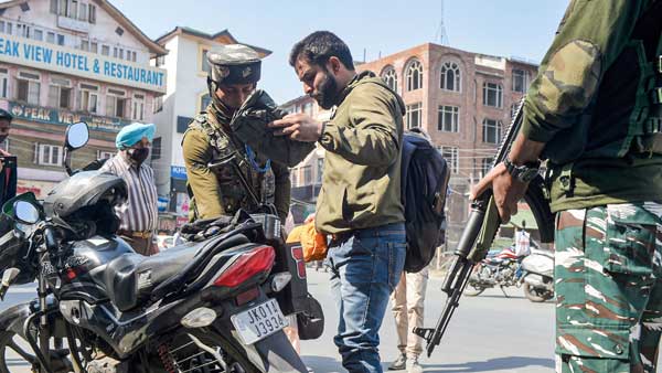 Police personnel frisk a passenger during a high alert sounded following the recent militant attacks, in Srinagar Police personnel frisk a passenger during a high alert sounded following the recent militant attacks, in Srinagar
