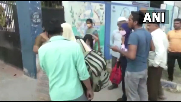 Watch: Argument between parents, teacher outside Rotary School in Mandya over hijab in classroom Watch: Argument between parents, teacher outside Rotary School in Mandya over hijab in classroom