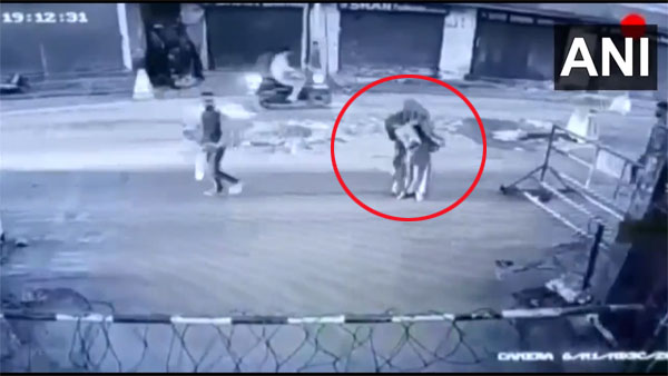 Watch: Burqa clad woman hurls bomb at CRPF camp in J&K Watch: Burqa clad woman hurls bomb at CRPF camp in J&K