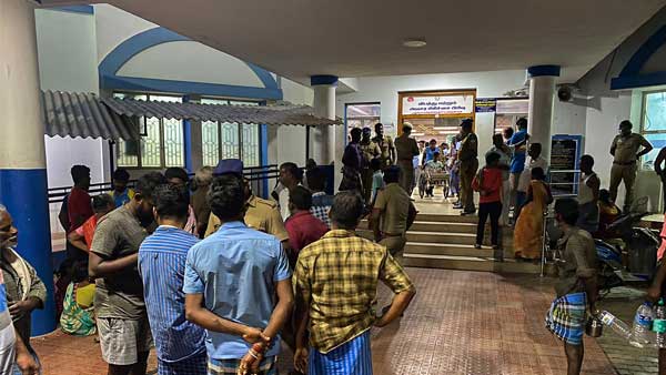 Locals and relatives of the injured at a hospital after several people were electrocuted during a chariot procession Locals and relatives of the injured at a hospital after several people were electrocuted during a chariot procession