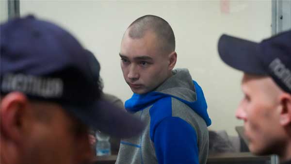 Russian army Sergeant Vadim Shishimarin, 21, is seen behind a glass during a court hearing in Kyiv Russian army Sergeant Vadim Shishimarin, 21, is seen behind a glass during a court hearing in Kyiv