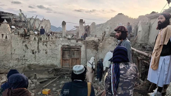 Afghans look at destruction caused by an earthquake in the province of Paktika, eastern Afghanistan Afghans look at destruction caused by an earthquake in the province of Paktika, eastern Afghanistan