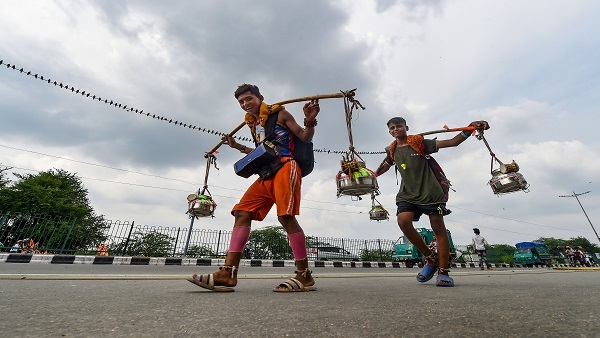 Lord Shiva devotees or 'Kanwariyas' carry holy water in Delhi 
