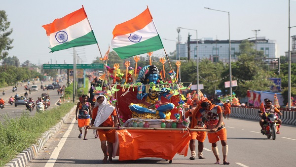 Kanwariyas (Lord Shiva devotees) pull a chariot of Lord Shiva