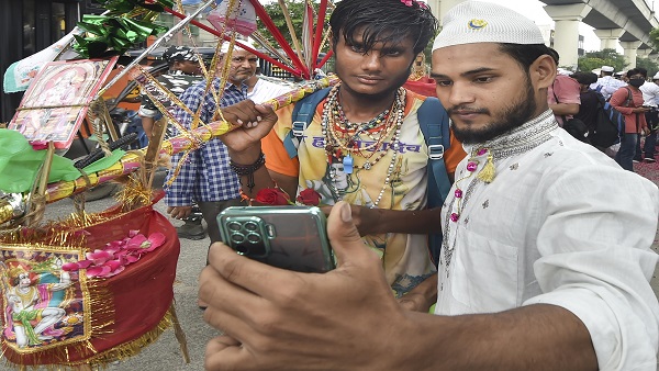 A Muslim man takes a selfie with a Kanwariya