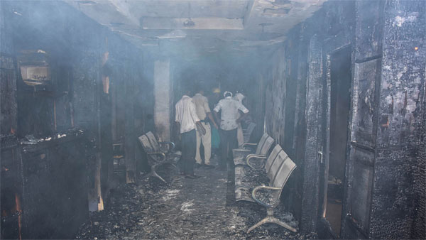 Police and fire personnel ispect after a major fire broke out at the Life Multispeciality Hospital at Damoh Naka, in Jabalpur Police and fire personnel ispect after a major fire broke out at the Life Multispeciality Hospital at Damoh Naka, in Jabalpur