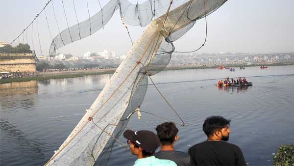 Rescue operation underway after the collapse of a suspension bridge over the Machchhu river, in Morbi district