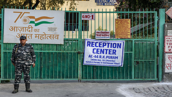 A security personnel stands guard outside a strong room, where EVMs are kept, ahead of the counting for the Municipal Corporation of Delhi (MCD) elections result. Image credit: PTI A security personnel stands guard outside a strong room, where EVMs are kept, ahead of the counting for the Municipal Corporation of Delhi (MCD) elections result. Image credit: PTI