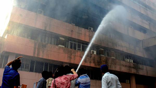 Firemen douse fire that broke out on the third floor of Satpura Bhawan, a building housing offices of various departments of the Madhya Pradesh government, in Bhopal