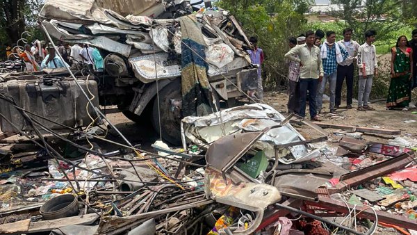 Wreckage of a container truck after it hit four vehicles and then rammed into a hotel on a highway, in Dhule