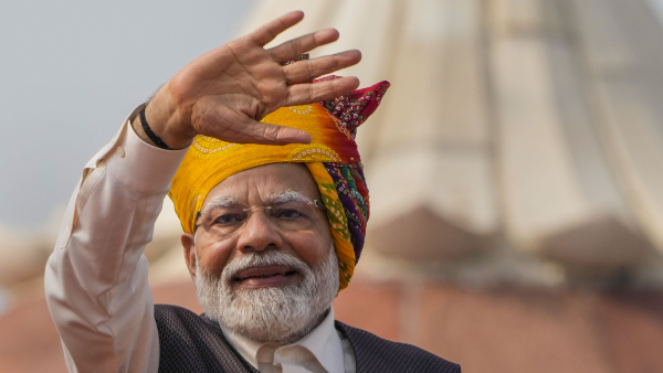 Prime Minister Narendra Modi waves after his address to the nation from the historic Red Fort on the occasion of the 77th Independence Day, in New Delhi