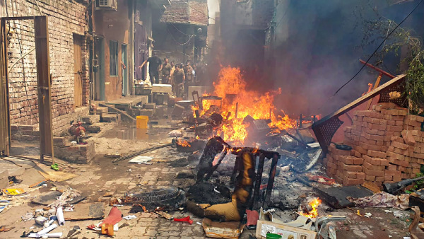Church properties were set ablaze after being attacked by a mob over blasphemy allegations, in Pakistans Faisalabad