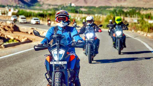 Congress leader Rahul Gandhi rides a bike to Pangong Lake in Leh
