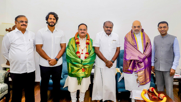 Union Home Minister Amit Shah and BJP National President JP Nadda with former Karnataka chief minister H.D. Kumaraswamy durig a meeting, in New Delhi
