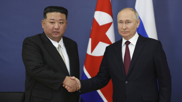 Russian President Vladimir Putin, right, and North Koreas leader Kim Jong Un
