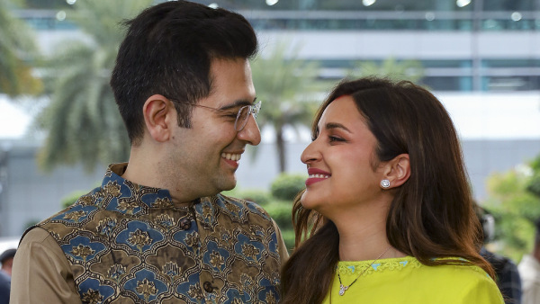 Newly-wed actor Parineeti Chopra and AAP MP Raghav Chadha pose for photographs upon their arrival in New Delhi